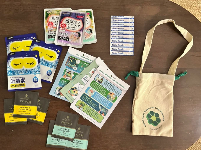 The Pause, Refresh, Restore Care Pack contents: eye masks, calming teas, wind-down guides, breathing strips and the iGROW tote